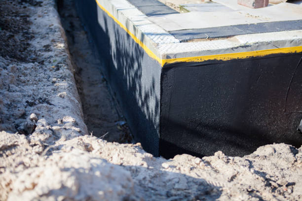 Professional Emergency Waterproofing technician working in Lewisburg, OH